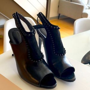 Angela Mitchell Damabiah is an ankle bootie featuring embossed lace